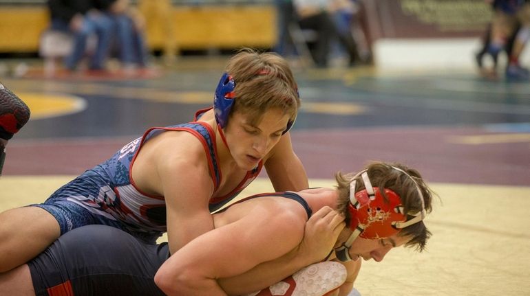 South Side's Kyle Mosher on top against MacArthur's Christian Dougherty last...