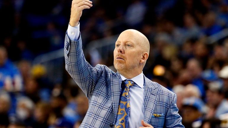 UCLA head coach Mick Cronin directs his players against Arizona...