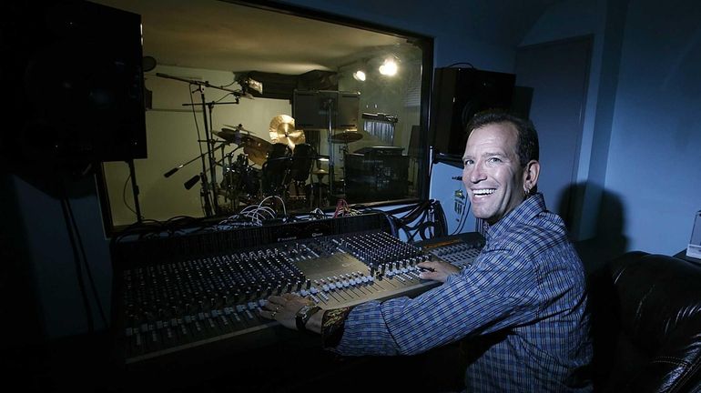 Anthony Castelli at the console in the control room of...