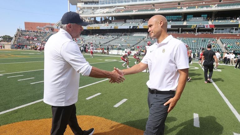 Utah head coach Kyle Whittingham, left, and Baylor head coach...