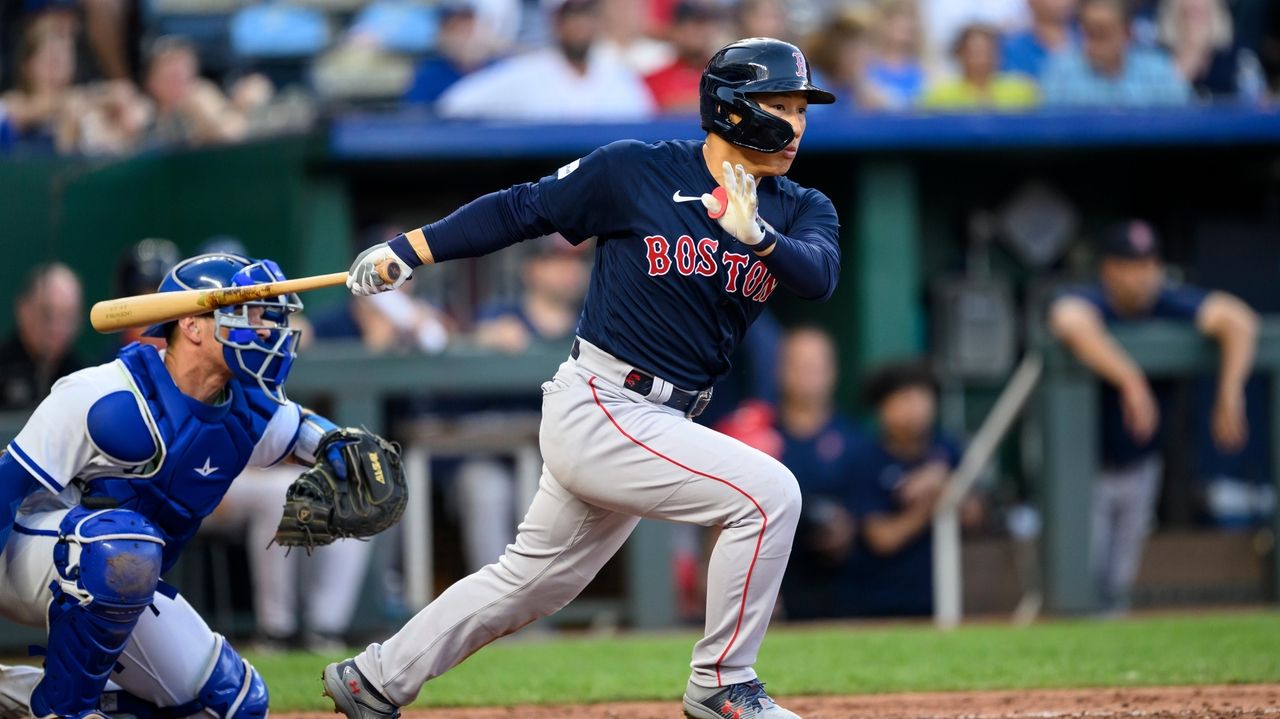 Boston Red Sox 1B Triston Casas, left, reacts to a triple play in