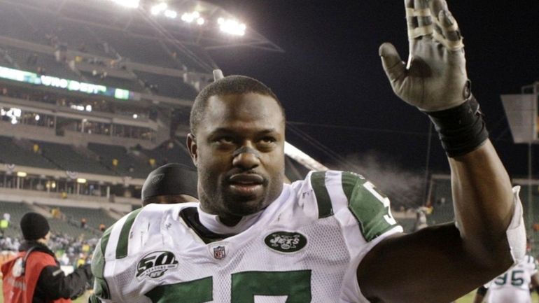 Linebacker Bart Scott #57 of the New York Jets walks...