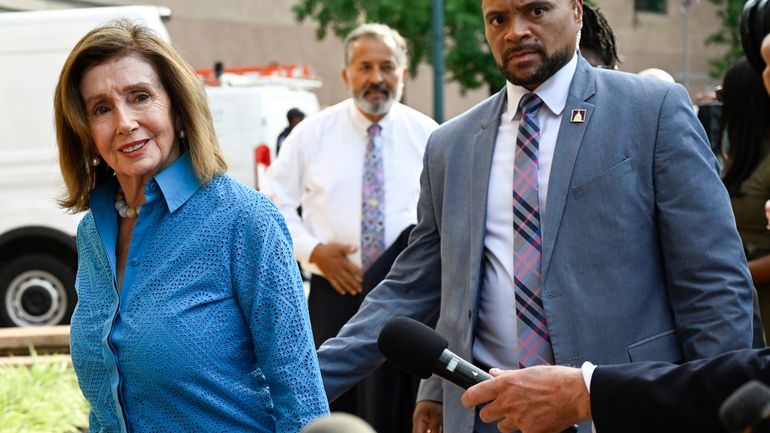 Rep. Nancy Pelosi, D-Calif., the speaker emerita, left, arrives at...