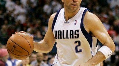 Dallas Mavericks guard Jason Kidd bringing the ball down court...