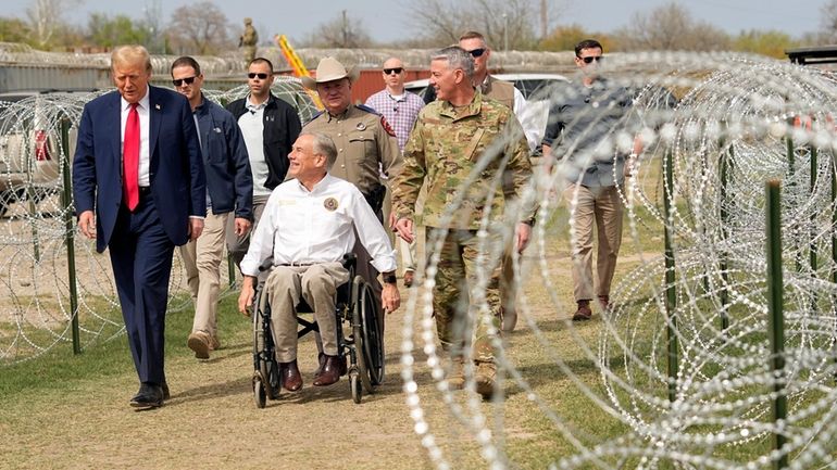 Republican presidential candidate former President Donald Trump talks with Texas...