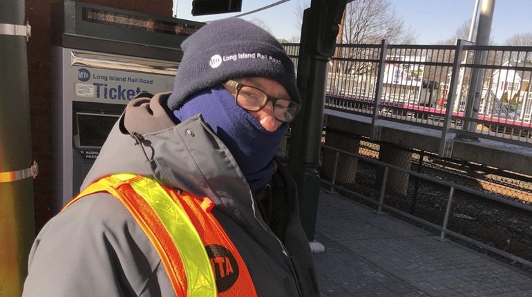 LIRR worker John Unger wore two scarves, a pair of...