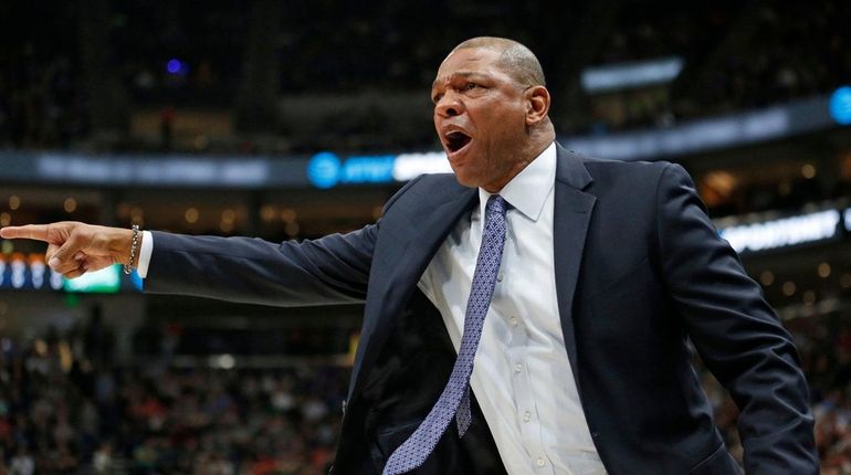 Clippers head coach Doc Rivers shouts to his team in...