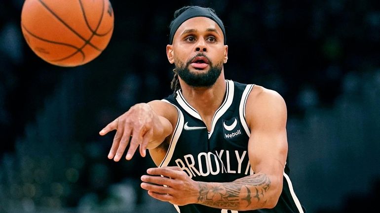 Brooklyn Nets guard Patty Mills passes the ball during the...