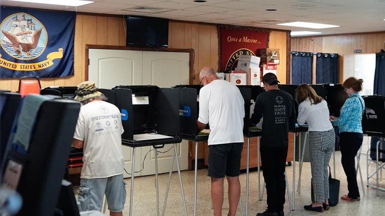 Voters fill in their ballots for Florida's primary election in...