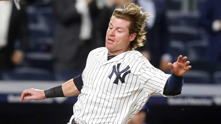 Ben Gamel #38 of the New York Yankees scores an...