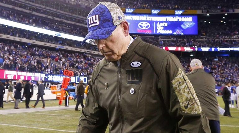 Head coach Tom Coughlin of the New York Giants walks...