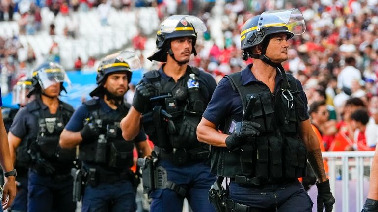 Police are seen near the pitch during a men's semifinal...