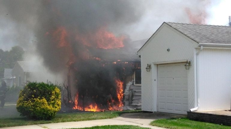 A house fire closed a portion of Jerusalem Avenue in...