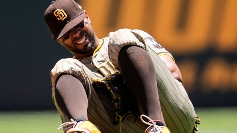 San Diego Padres second baseman Xander Bogaerts (2) kneels after...