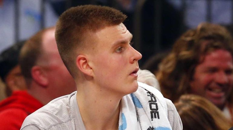 Kristaps Porzingis of the New York Knicks looks on from...