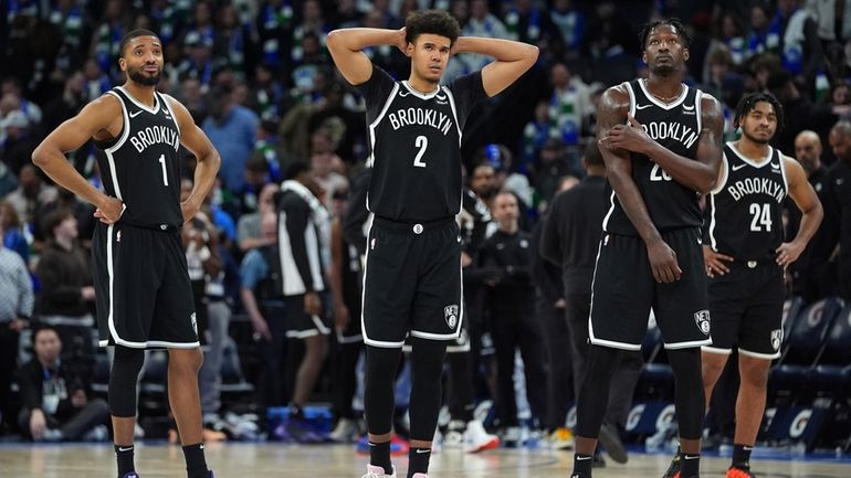 Nets forwards Mikal Bridges (#1), Cameron Johnson (#2) and Dorian...