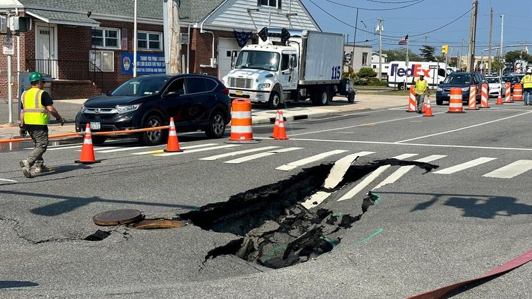 The sinkhole on Lido Boulevard in Lido Beach is seen...