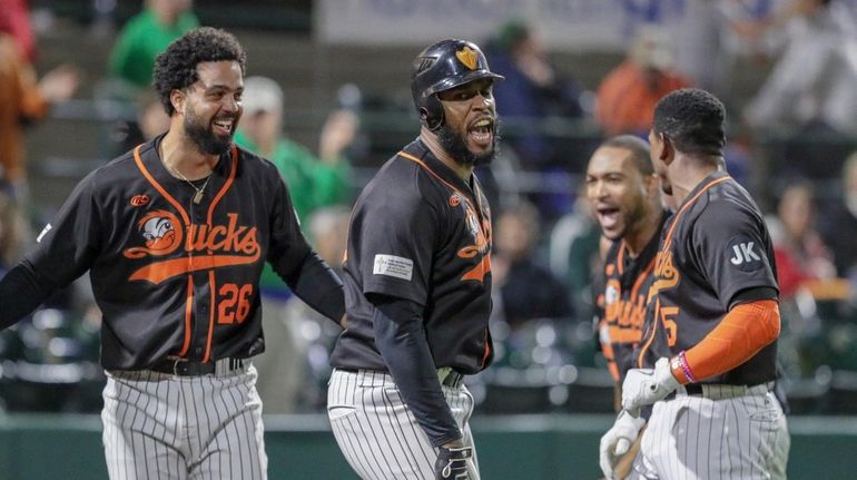 David Washington #30 of the Long Island Ducks celebrates after...