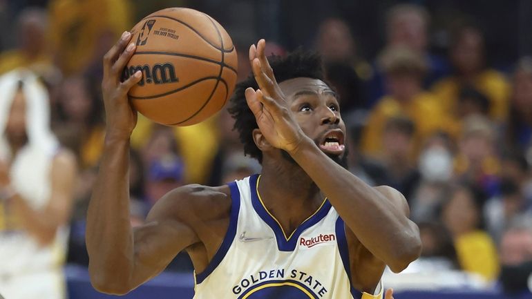 Golden State forward Andrew Wiggins shoots against Boston Celtics guard Jaylen...