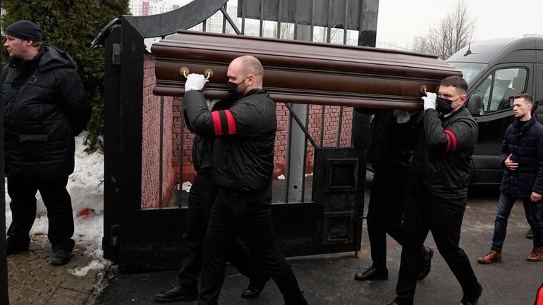 A coffin of Russian opposition leader Alexei Navalny is carried...