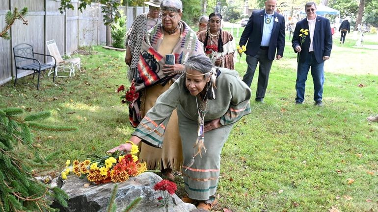 Members of the Montaukett Indian Nation during the dedication of a...