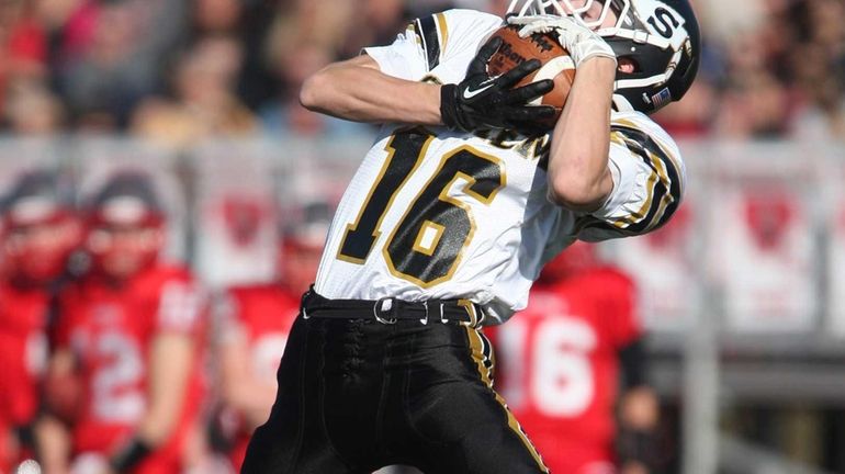 Sachem North's Jake Slater pulls a pass down during the...