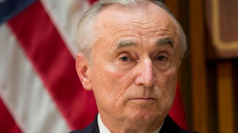 NYPD Commissioner William Bratton listens to a question during a...