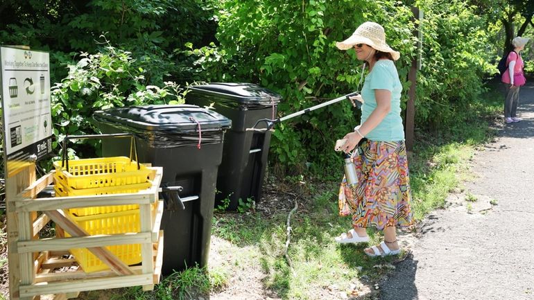 Xiao Xing, of Queens, uses a newly installed cleanup station...