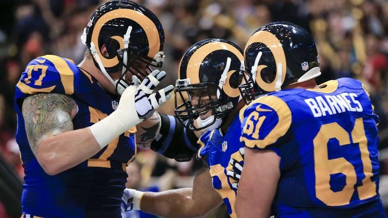 St. Louis Rams tight end Lance Kendricks, center, celebrates with...