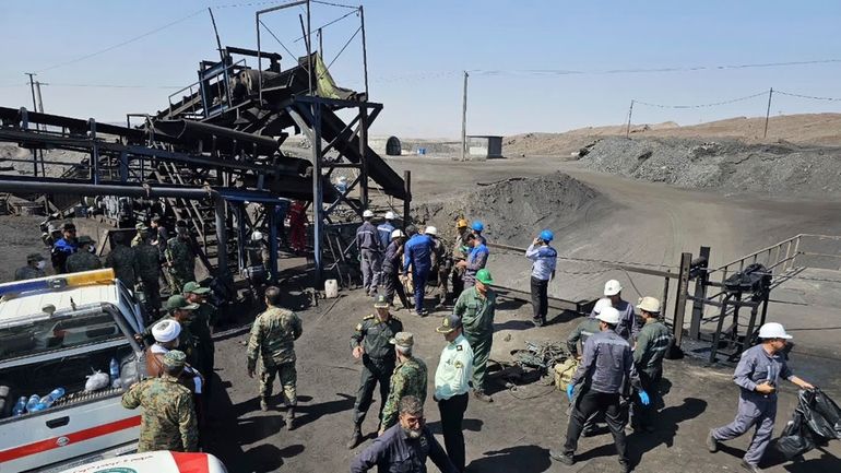 In this photo released by Iranian Red Crescent Society, miners...