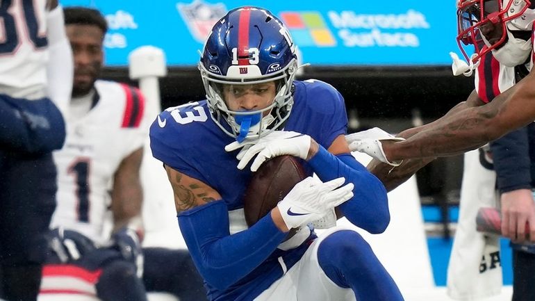 Giants wide receiver Jalin Hyatt makes a catch against Patriots cornerback J.C....