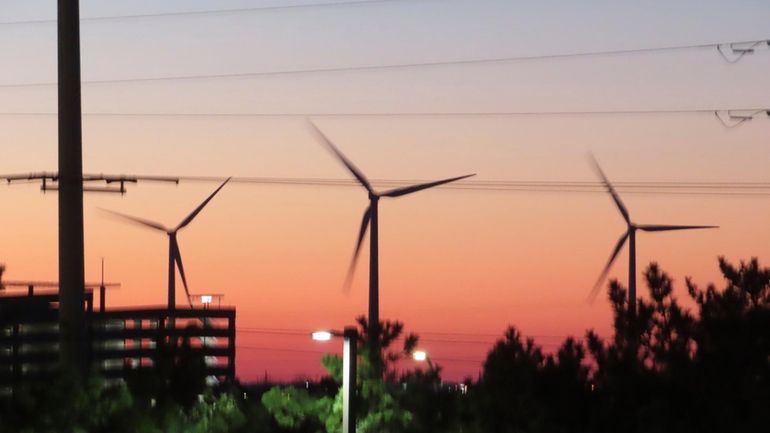 Land-based wind turbines spin in Atlantic City, N.J., on Dec....