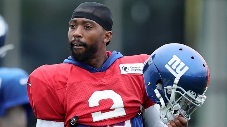 New York Giants quarterback Tyrod Taylor watches as the third team...