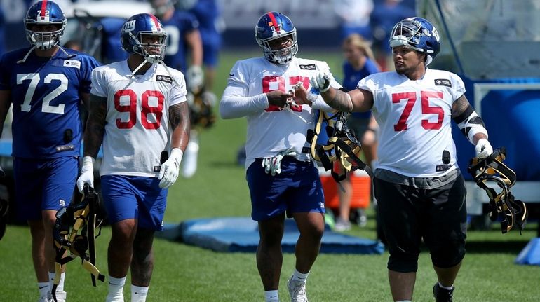 New York Giants defensive tackle Danny Shelton (75) talks to...