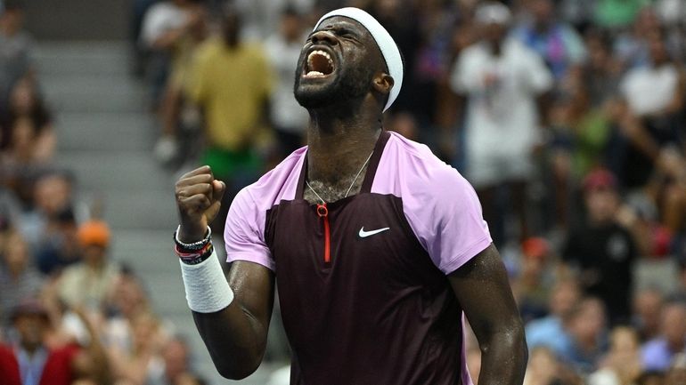 Frances Tiafoe reacts against Rafael Nadal during the 2022 U.S....