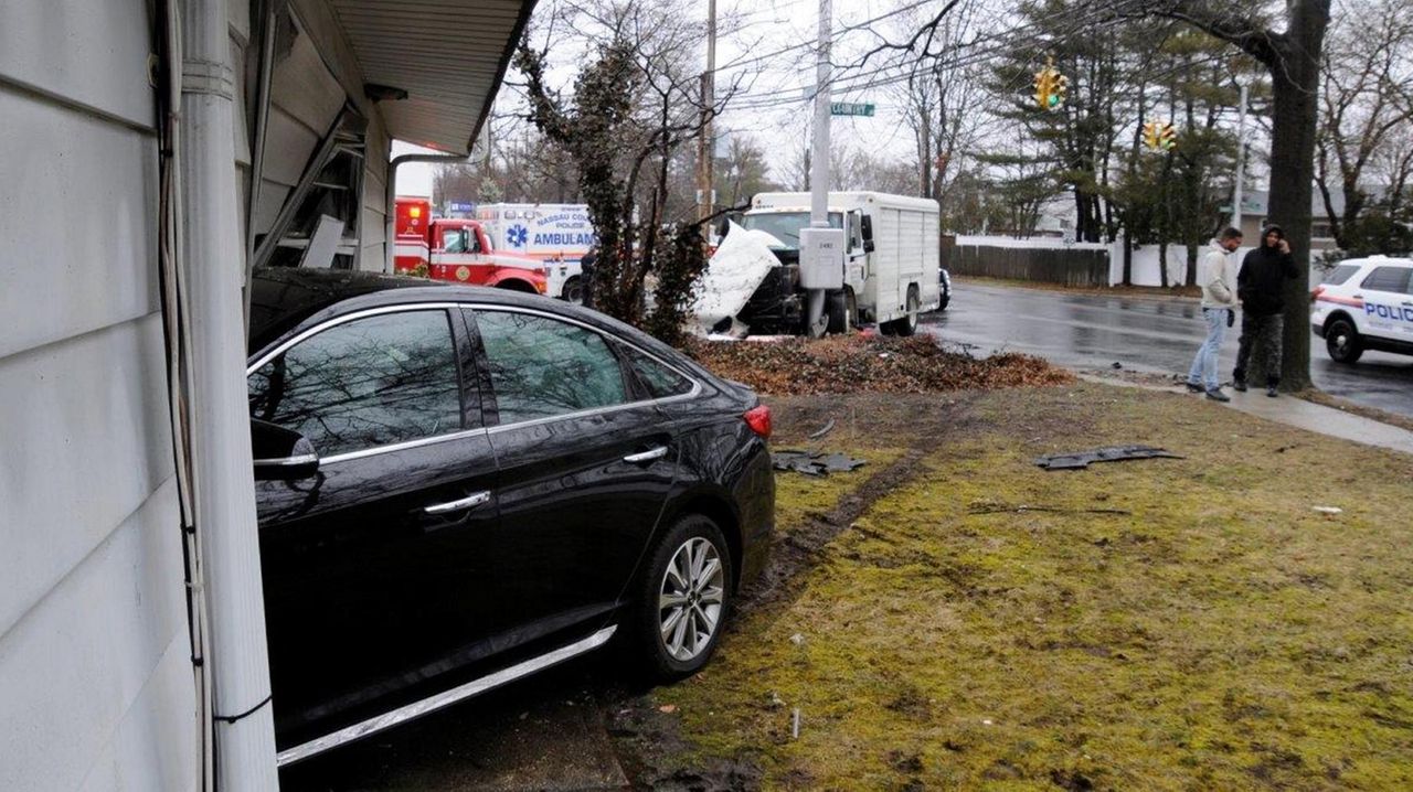 Officials Car slams into Plainview house after crash with truck Newsday