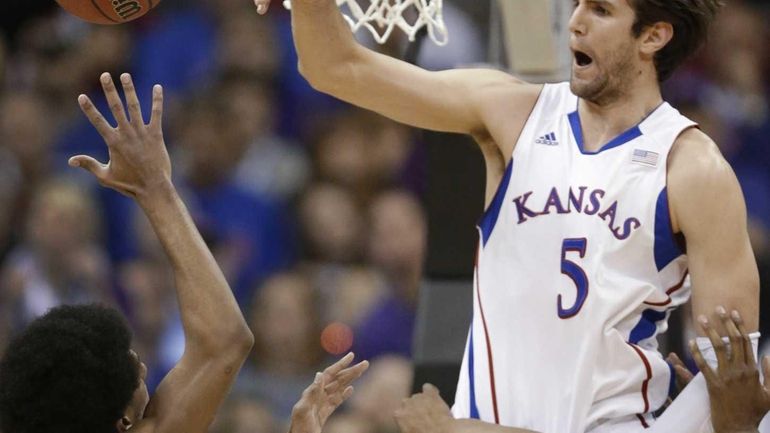 Kansas center Jeff Withey blocks a shot by Kansas State...