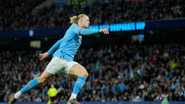 Manchester City's Erling Haaland celebrates after scoring his side's opening...