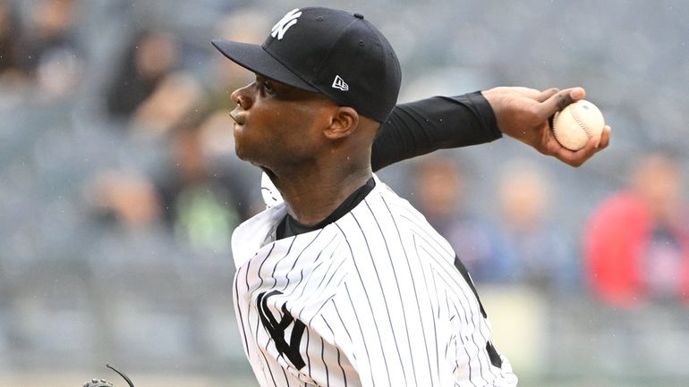 Yankees starting pitcher Domingo German delivers against the Twins in...