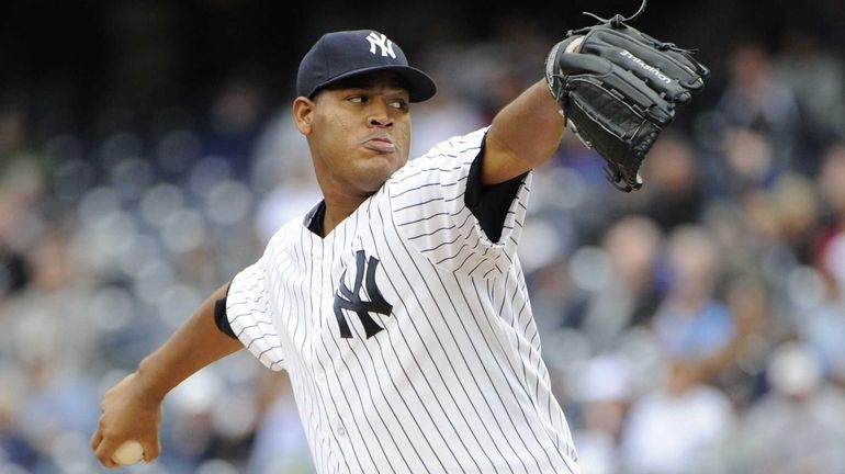 Ivan Nova delivers a pitch during a game against the...