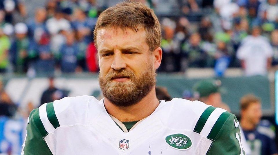 New York Jets quarterback Ryan Fitzpatrick poses with his sons, Brady,  left, and Tate, right, after the Jets defeated the Miami Dolphins, 38-20,  in an NFL football game Sunday, Nov. 29, 2015