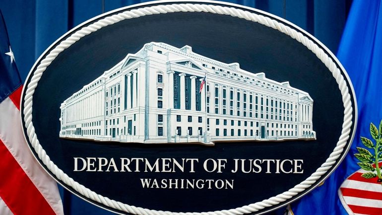 A U.S. Department of Justice sign is seen, Nov. 18,...