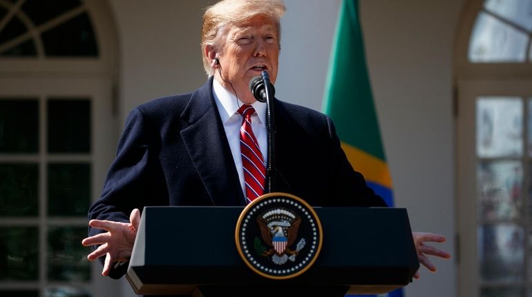 President Donald Trump speaks during a news conference with Brazilian...