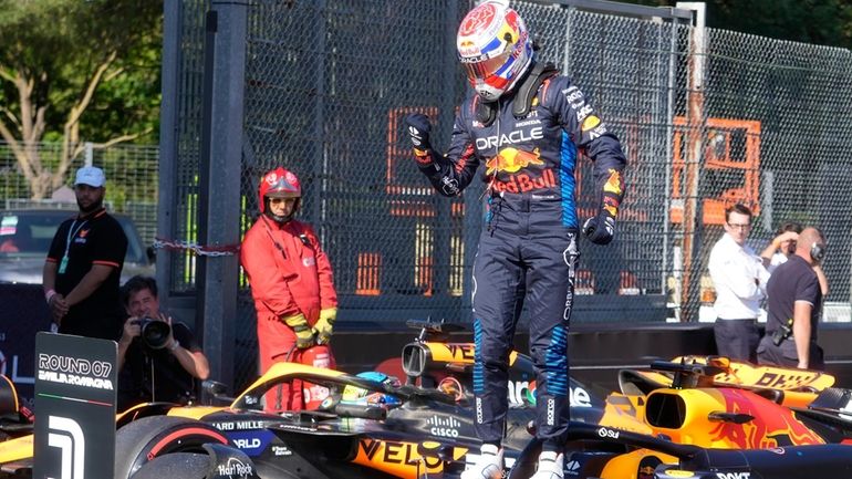 Red Bull driver Max Verstappen of the Netherlands celebrates after...