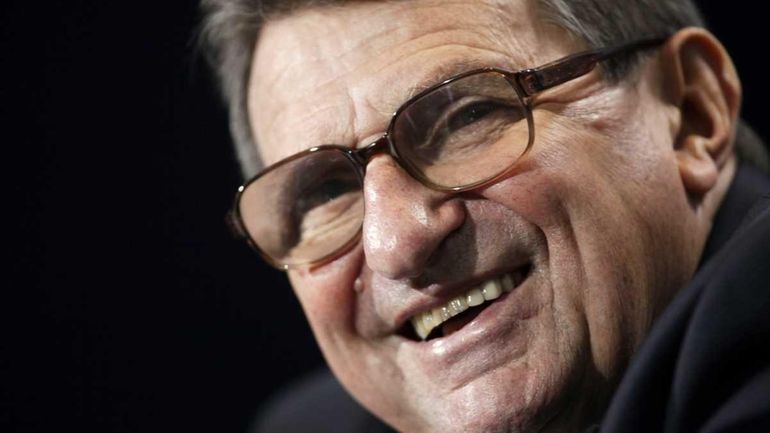 Penn State football coach Joe Paterno laughs during a news...