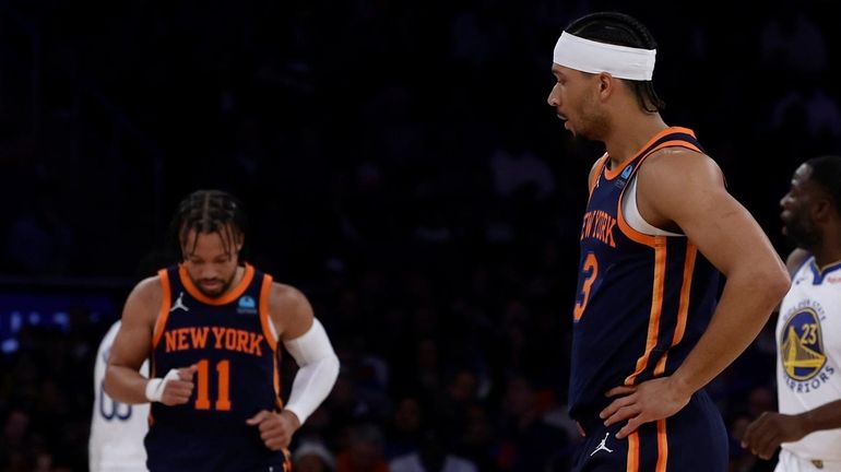 Josh Hart and Jalen Brunson of the Knicks look on during...