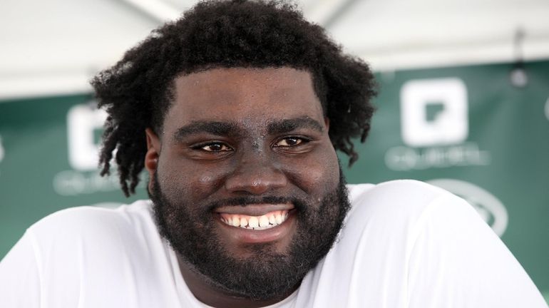 Jets' Mekhi Becton speaks to reporters at Jets camp in Florham Park,...