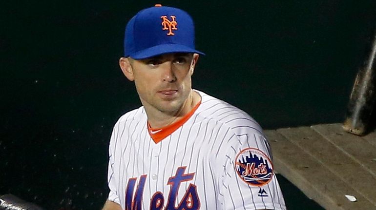 Mets captain David Wright looks on from the dugout before...