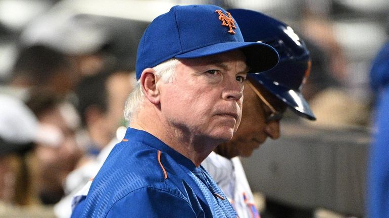 Mets manager Buck Showalter looks on from the dugout during...