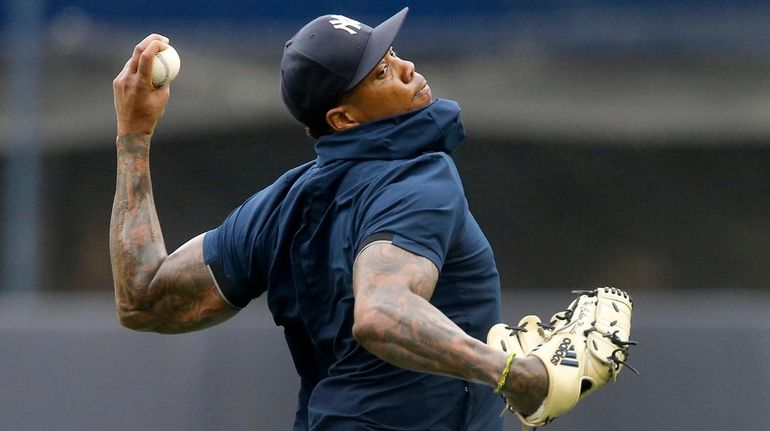 Aroldis Chapman of the New York Yankees throws prior to...